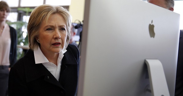 U.S. Democratic presidential candidate Hillary Clinton looks at a computer screen during a campaign stop at Atomic Object company in Grand Rapids, Michigan.