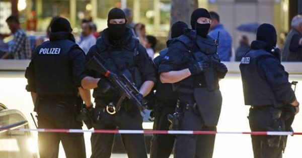 Special forces police officers guard a train station entrance, following a shooting rampage at the Olympia shopping mall in Munich, July 22, 2016.