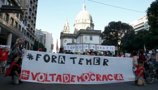 Protesters take part in a demonstration against coup-imposed President Michel Temer in the center of Rio de Janeiro, Brazil, July 31, 2016.