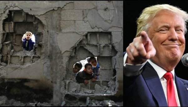 Palestinian children peer through holes in a wall in Jabaliya, Gaza Strip, created by Israeli shelling.