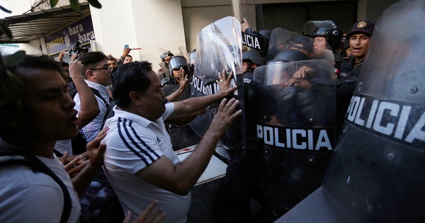 Teachers scuffle with police blocking the access to a commercial area during a protest against President Enrique Pena Nieto's education reform, in Monterrey, Mexico July 13, 2016.