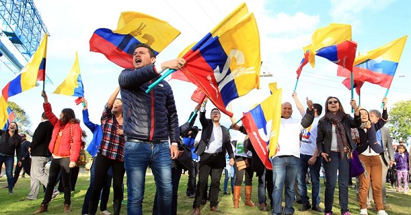 Colombians wave flags in support of a 