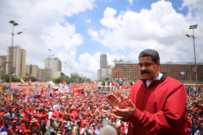 President Nicolas Maduro addresses a crowd of government supporters, eager to defend the government against opposition calls for a recall referendum. 