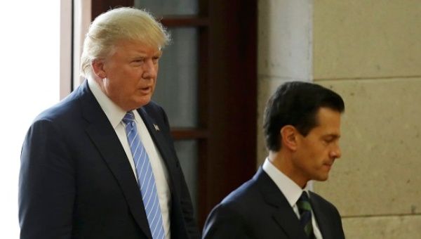 U.S. Republican presidential nominee Donald Trump and Mexico's President Enrique Pena Nieto arrive for a press conference in Mexico City, Mexico, August 31, 2016.