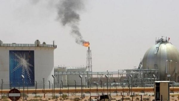 A gas flame is seen in the desert near the Khurais oilfield, about 160 km (99 miles) from Riyadh, Saudi Arabia June 23, 2008.