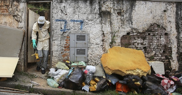 A worker from the Ministry of Health fumigates a neighborhood in Sao Paulo.