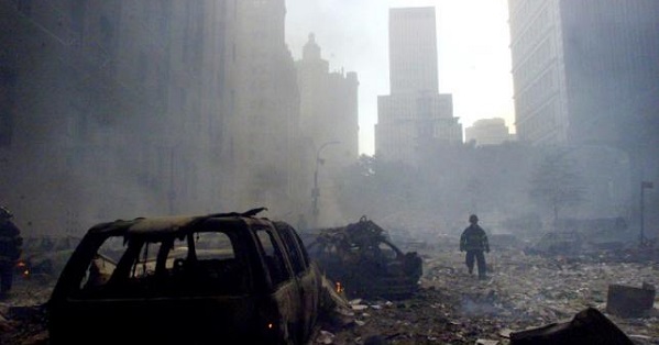 A firefighter walks amid rubble near the base of thedestroyed World Trade Center in New York on September 11, 2001.