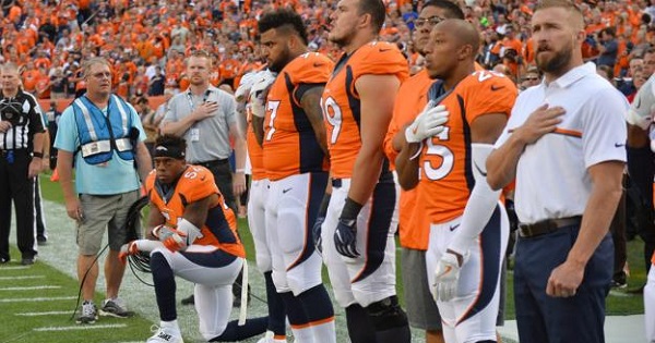 Denver Broncos inside linebacker Brandon Marshall kneels during the national anthem before the game against the Carolina Panthers, Sept. 8, 2016.
