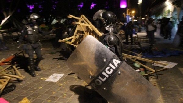 Police forcibly evict teachers and informal vendors from their protest encampment in the main plaza in the City of Oaxaca, Sept. 11, 2016.