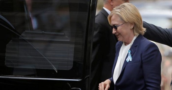 Clinton gets into her van outside her daughter Chelsea's home in New York after she left ceremonies commemorating the 15th anniversary of the September 11 attacks feeling 'overheated.'