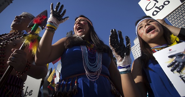 Ecuadoreans protest against Chevron's Racketeer Influenced and Corrupt Organizations trial in New York, Oct. 15, 2013.