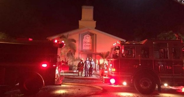 Emergency personnel are seen at the Islamic Center of Fort Pierce which was set on fire in Fort Pierce, Florida, Sept. 12, 2016.