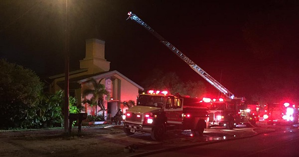 Emergency personnel are seen at the Islamic Center of Fort Pierce which was set on fire, in Fort Pierce, Florida, Sept. 12, 2016.