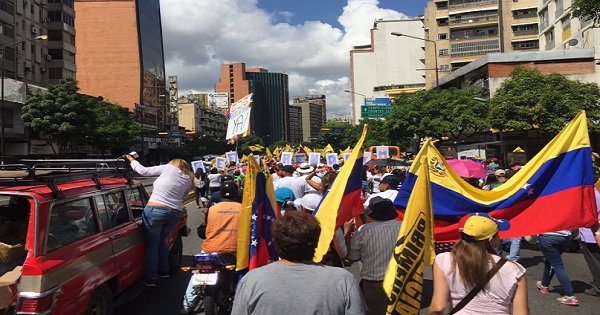 A small group of opposition protesters march in Caracas, Venezuela