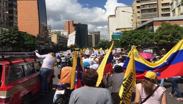 A small group of opposition protesters march in Caracas, Venezuela 