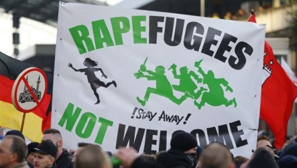  Right-wing anti-immigration supporters rally in Cologne, Germany.