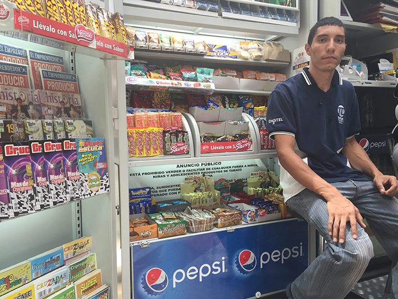 27 year-old Jesus Carranza has worked a Caracas mall kiosk for seven years. 