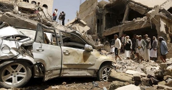People gather at the site of a Saudi-led air strike in Yemen's capital Sanaa September 21, 2015