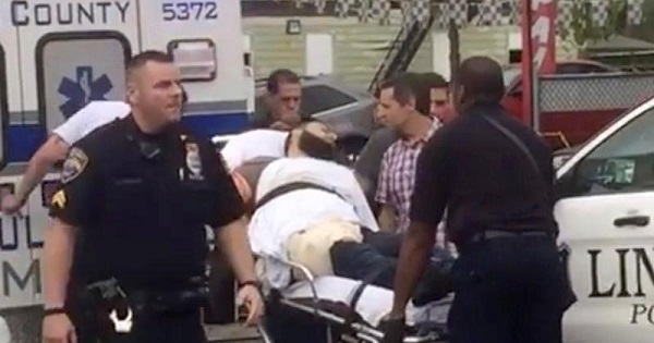 Policemen place a man in an ambulance they identified as Ahmad Khan Rahami, suspect in an explosion, Linden, New Jersey, Sept. 19, 2016.