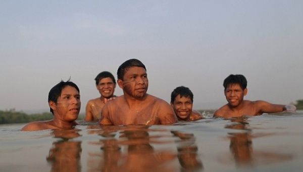 Indigenous people from the Guarani Kaiowanation are seen in Tocantins river in Palmas, Brazil, Oct. 21, 2015.
