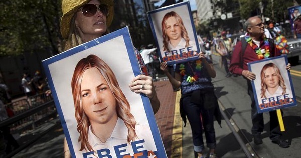 People hold signs calling for the release of Chelsea Manning in San Francisco.