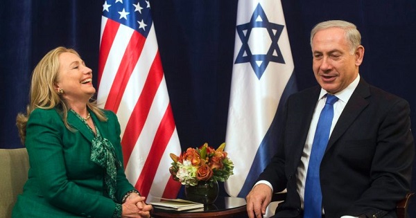 Then U.S. Secretary of State Hillary Clinton laughs during a meeting with Israeli Prime Minister Benjamin Netanyahu, September 27, 2012.