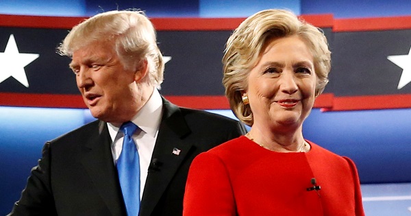 Trump and Clinton greet one another as they take the stage for their first debate at Hofstra University, New York, U.S.