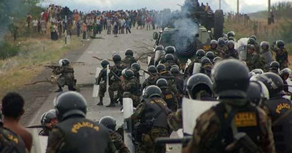 Peruvian riot police approach protesters in a crackdown that led to the massacre known as the 