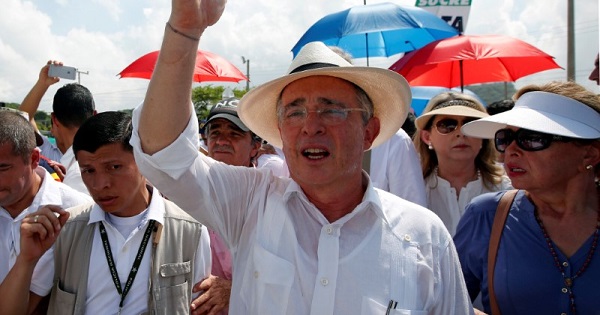 Alvaro Uribe waves during a protest against the government's peace agreement with the FARC in Cartagena, Colombia, Sept. 26, 2016.