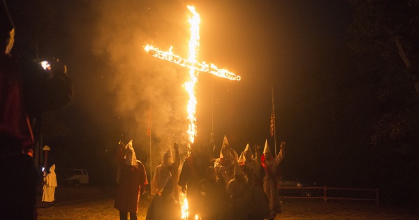 Groups with affiliations to the Ku Klux Klan take part in a cross burning ceremony, Henry County, Virginia.