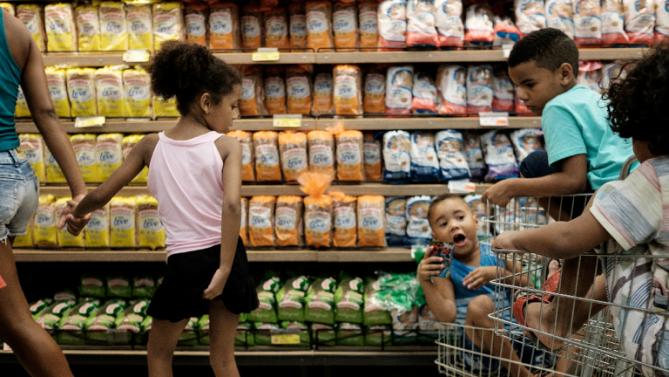 Children at a supermarket in Rio de Janeiro on Dec. 21, 2015 as Brazilians shop for Christmas groceries