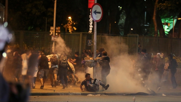 Brazilian protesters are fired upon with tear gas and rubber bullets.