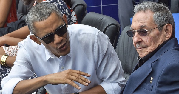 Barack Obama watches baseball with Cuba's Raul Castro.