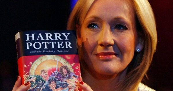 British author J.K. Rowling poses with a copy of her new book 