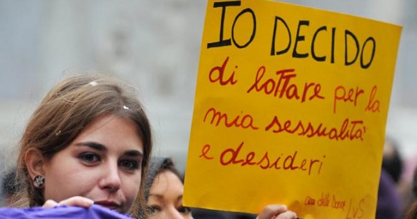 A woman holds a banner reading ''I decide'' during a demonstration in central Rome against a reform of Spain's abortion law in 2014.