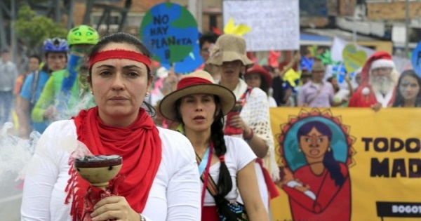 Women activists take part in a march ahead of the 2015 Paris Climate Change Conference, known as the COP21 summit, in Bogota, Colombia November 29, 2015.