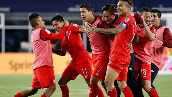  Peru forward Raul Ruidiaz (11) is mobbed by teammates after their 1-0 win over Brazil in the group play stage of the 2016 Copa America.