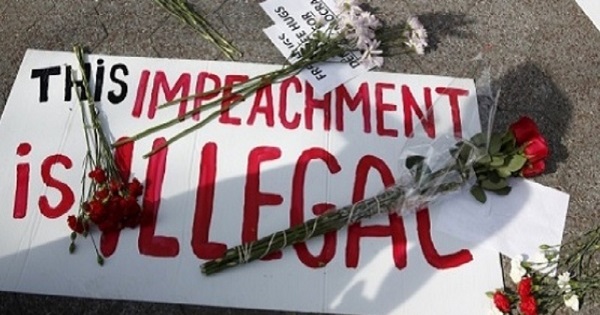 A protest sign during a rally against Rousseff's impeachment during the president's visit to New York, April 22, 2016.