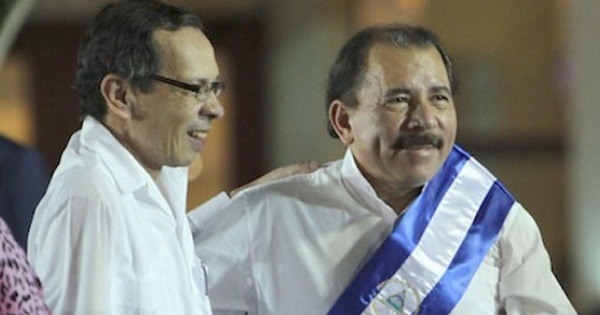 Rene Nuñez Tellez (L) next to Nicaraguan President Daniel Ortega