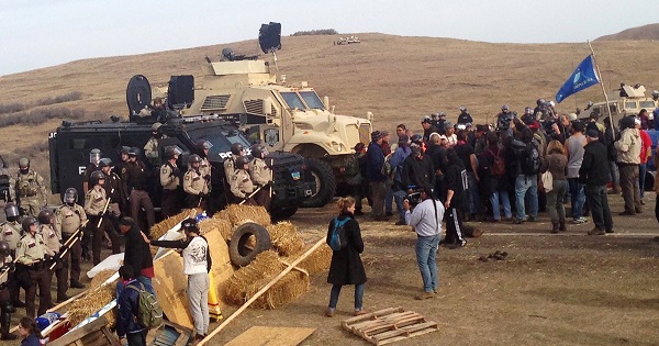 TigerSwan Security, a firm with experience in Iraq and Afghanistan, is collecting intelligence on Dakota Access Pipeline protesters. Law enforcement has adapted increasingly militarized responses to the protests.