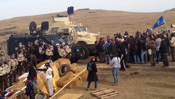 TigerSwan Security, a firm with experience in Iraq and Afghanistan, is collecting intelligence on Dakota Access Pipeline protesters. Law enforcement has adapted increasingly militarized responses to the protests.