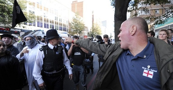 A member of the right-wing English Defence League shouts at police escorting Muslim demonstrators in London.