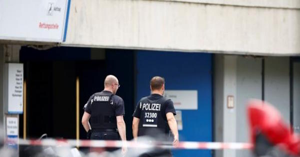 Police walks at the university clinic in Steglitz, a southwestern district of Berlin, July 26, 2016 after a doctor had been shot at and the gunman had killed himself.