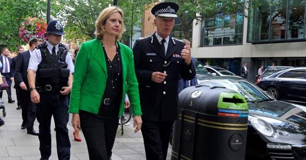 Britain's Home Secretary Amber Rudd walks with Metropolitan Police Commissioner Sir Bernard Hogan-Howe in Westminster, London, July 14, 2016.