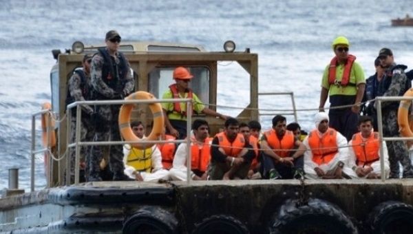 A boat carrying asylum seekers is intercepted off the Australian coastline