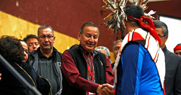 Grand Chief Stewart Phillip shakes the hands of First Nation leaders after they sign the Treaty Alliance Against Tar Sands Expansion.