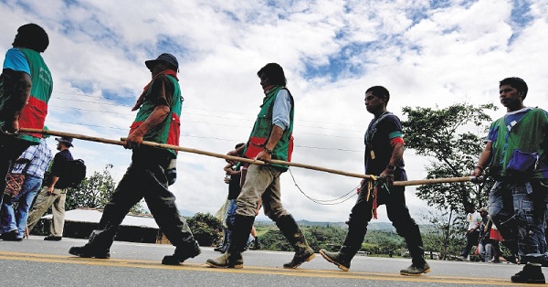 Indigenous Colombians marched through the country seeking land restitution in 2008.