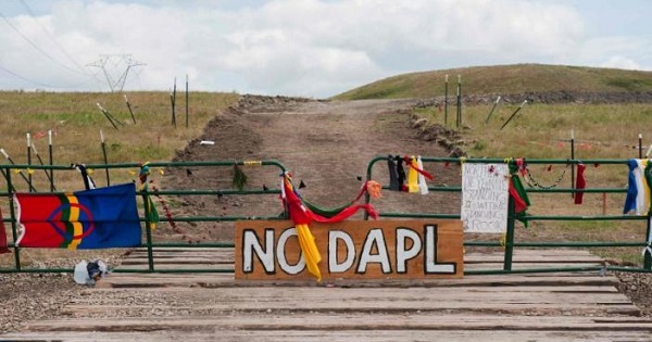 Signs left by protesters sit at the gate of a construction site near the Standing Rock Sioux reservation in North Dakota, U.S., Sept. 6, 2016