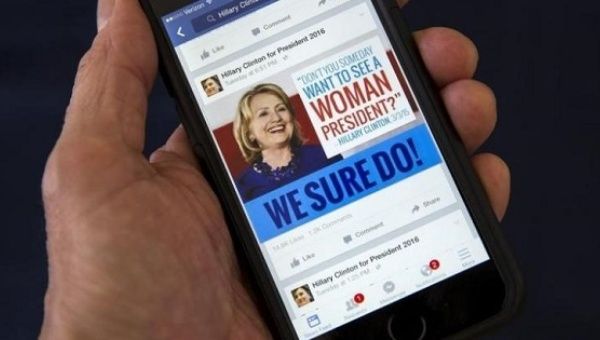A cell phone shows a Facebook page promoting Hillary Clinton for president in 2016, in this photo illustration taken Apr. 13, 2015. 