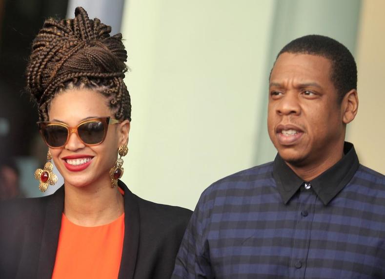 Beyonce and Jay-Z walk as they leave their hotel in Havana April 4, 2013.
